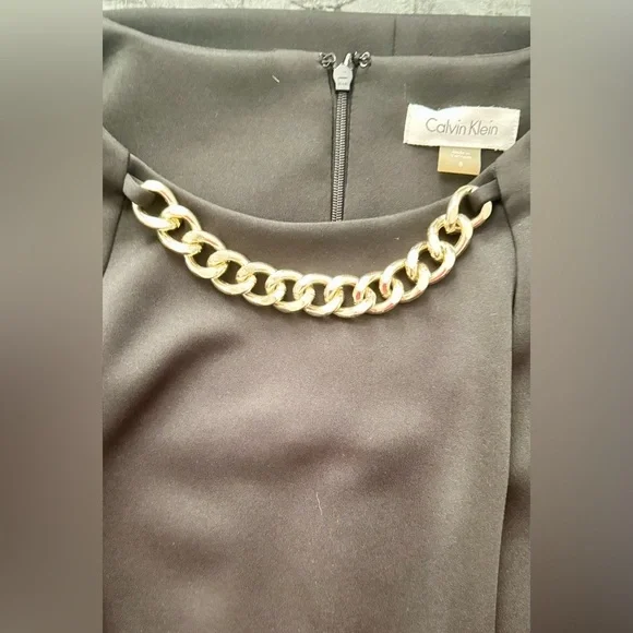 CALVIN KLEIN
Pre-loved Black Dress with Chain Accent💕
Size: 8 - Picture 9 of 10
